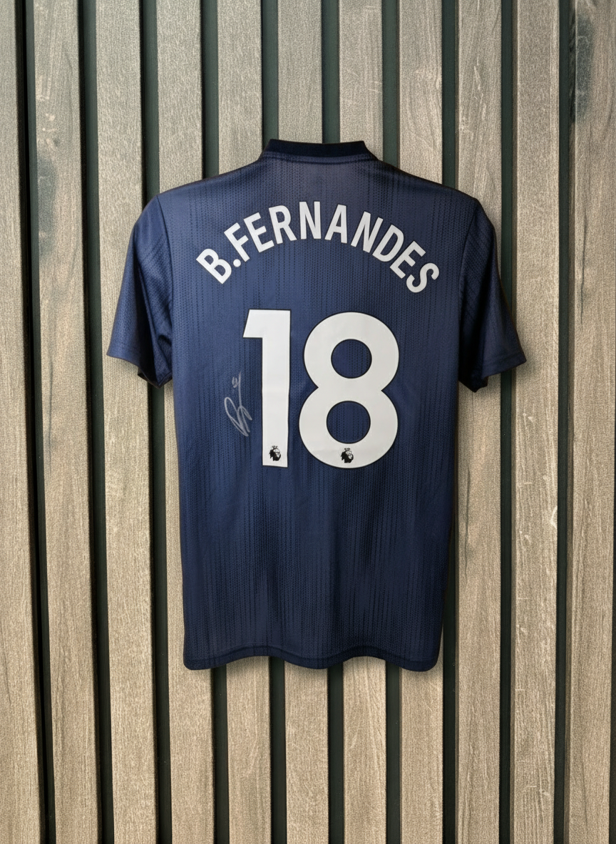 B.Fernandes signed shirt with light wooden background