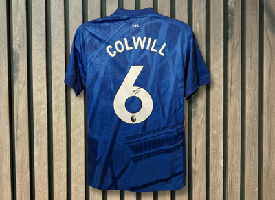 Colwill signed shirt on wooden background