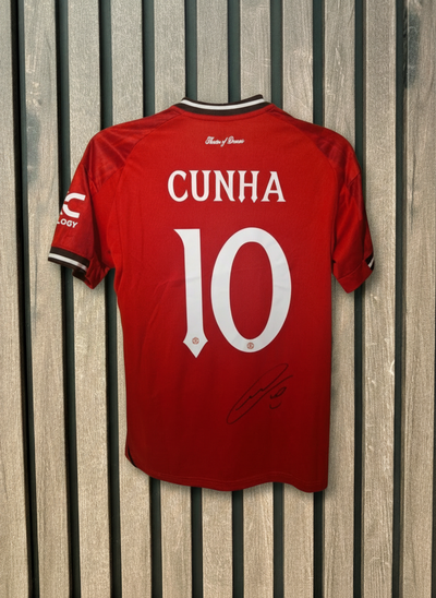 Cunha signed shirt with wooden background