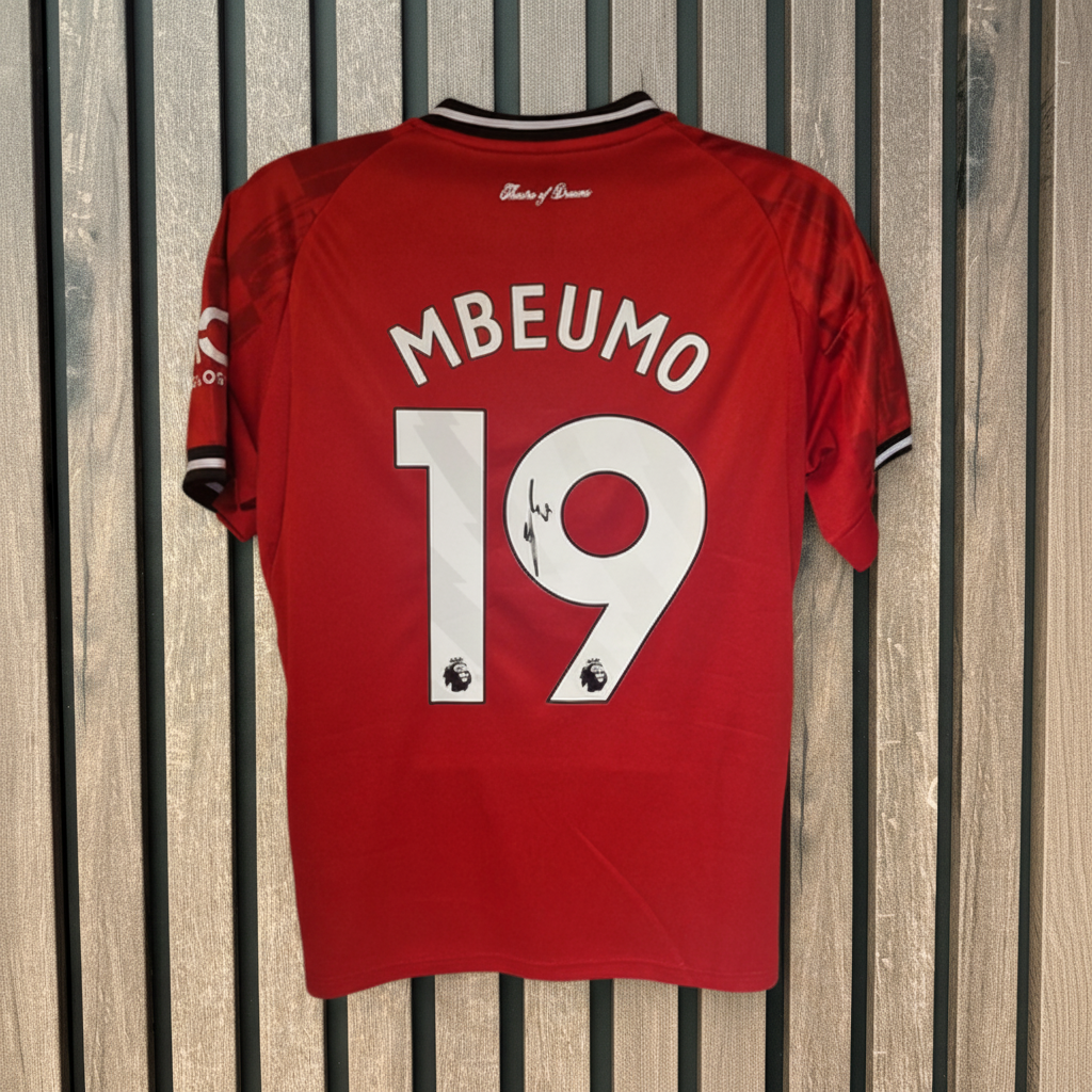 Mbeumo shirt on wood background