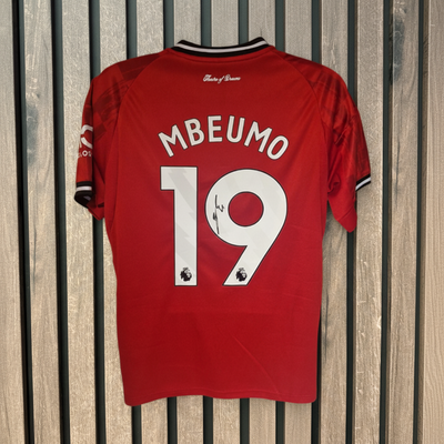 Mbeumo shirt on wood background