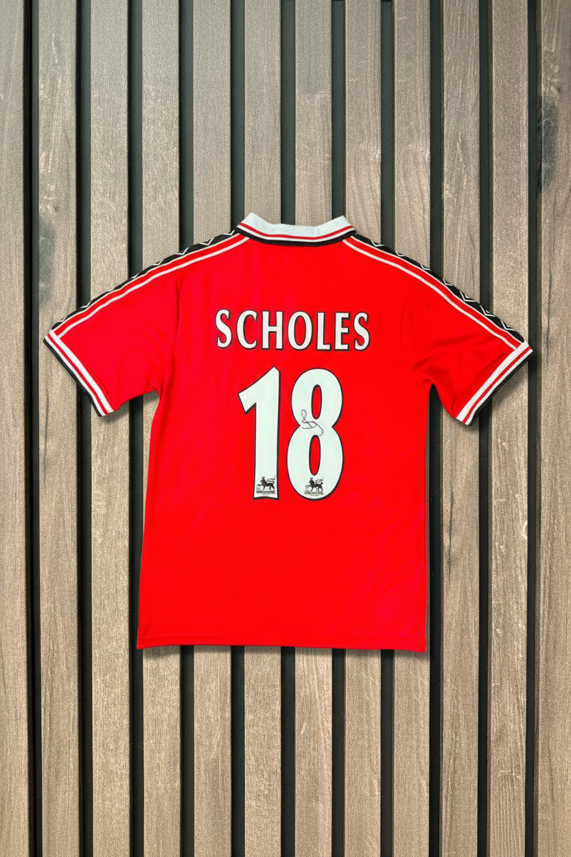 Scholes shirt on wooden wall