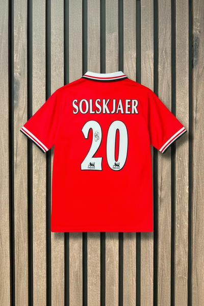 Solskjaer shirt on wooden wall