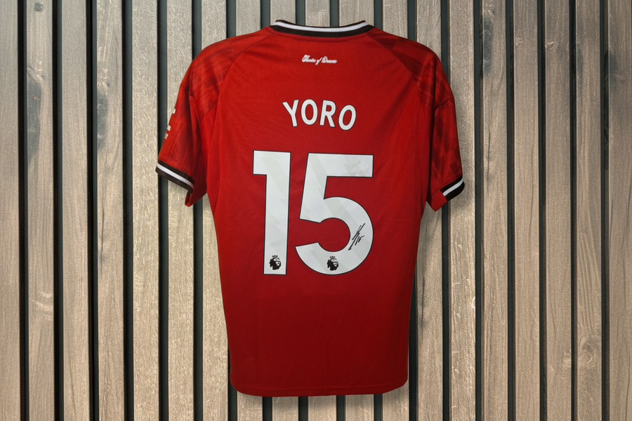 Yoro Manchester United shirt with wooden background