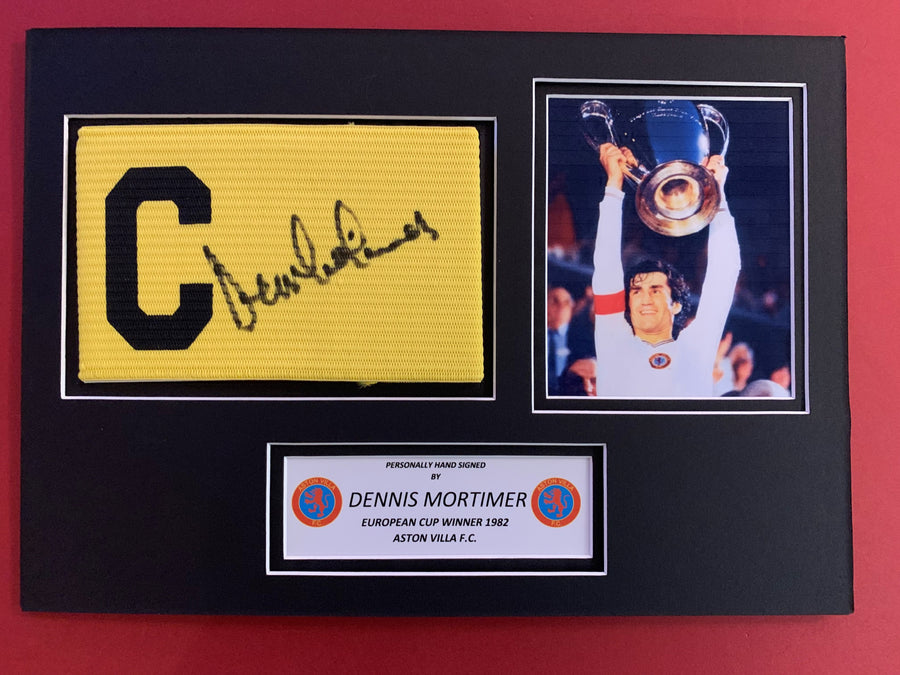 DENNIS MORTIMER - SIGNERT KAPTEINSBIND MED EKTEHETSBEVIS/COA